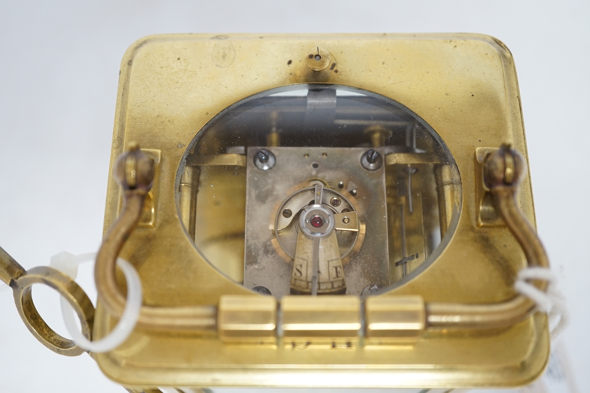 A brass cased repeating carriage clock with key, 14cm. Condition - good, currently ticking